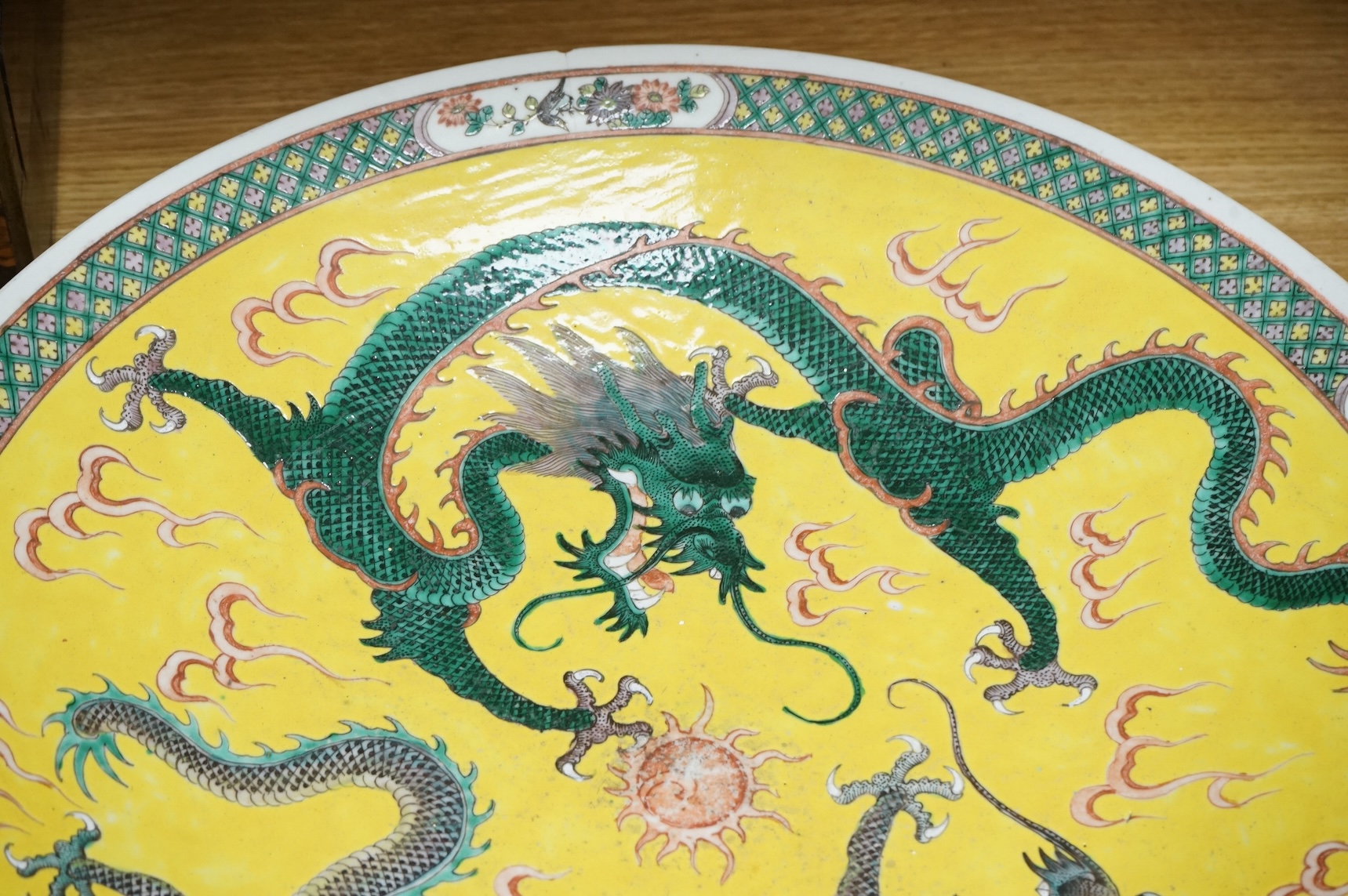 A Chinese yellow ground ‘dragon’ charger, Guangxu period (1875-1908), 47cm diameter.